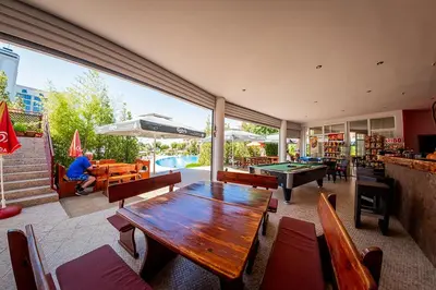 a dining room with a table and ping pong ball at Green Fort Noks - Private apartment - BSR - 3 in Sunny Beach