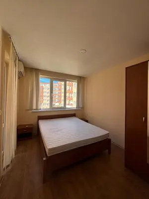 a bedroom with a large bed with a window at Privilege First Line Sea in Elenite