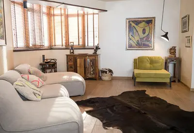 a living room with two couches and a chair at Modern Comfort & Vintage Charm with Panoramic View by Flat Mаnаger in Varna City