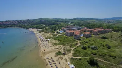 an aerial view of a beach with a resort at Beach Front Luxury Apartment in Sozopol