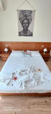 a bed with a statue of a woman on it at Apartment Anna-Kalina in Obzor
