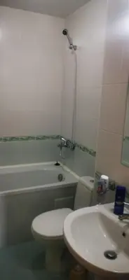 a bathroom with a toilet and a sink and a tub at Nice 2 Bedroom Apartment with Sea and Poolview near Aheloy in Kableshkovo