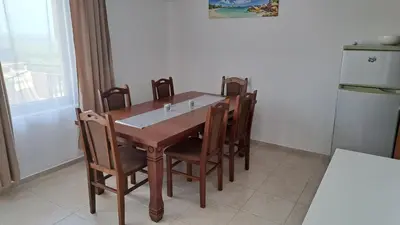 a dining room table and chairs in a kitchen at Nessebar Apartment Pablo in Sunny Beach