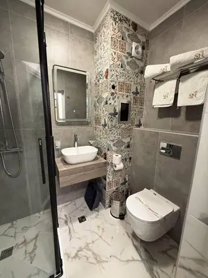 a bathroom with a toilet and a sink at Aparthotel Sveti Nikola in Pomorie