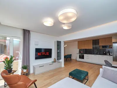 a living room with a couch and a tv at n17 Garden - Parking - WorkDesk - Blackout Rolls- Netflix - Wash&Dry in Burgas City
