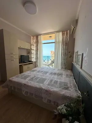 a bedroom with a bed and a window with a view at 2 bedroom apartment komplex Andalusia Elenite with terrasa and sea in Sveti Vlas