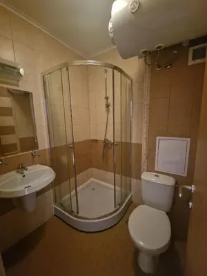 a bathroom with a shower and a toilet and a sink at Apartment at Royal Sun, Sunny Beach in Sunny Beach