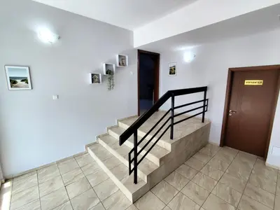 a staircase in a house with a stair railing at Хостел Спортна база Ветрен in Burgas City