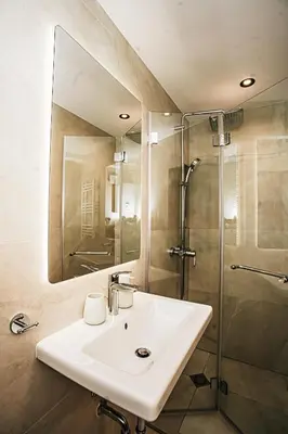 a bathroom with a sink and a shower at The Loft - Parking - Washer&Dryer - Port view - Balcony in Burgas City