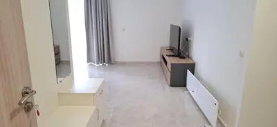 a hallway with a tv on a dresser and a television on a table at Star Dreams P2 in Sveti Vlas