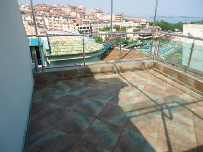 a balcony with a view of a city at Тихия кът in Sozopol