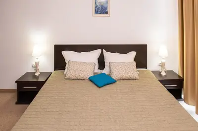 a bedroom with a large bed with two pillows at Atlantis Resort Private 1BD apart by Flat Mаnager in Burgas City