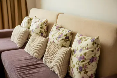 a bunch of pillows sitting on a couch at Atlantis Resort Private 1BD apart by Flat Mаnager in Burgas City