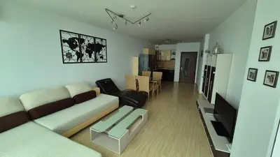 a living room with a couch and a table at Amazing panorama sea view apartment in Byala