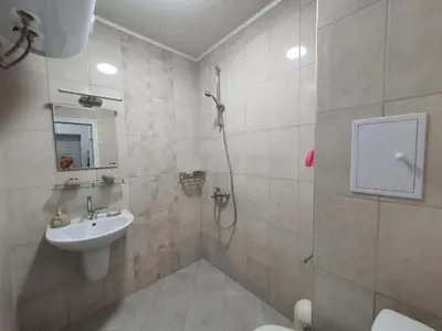 a bathroom with a shower and a sink and a toilet at Neptun-Blue in Primorsko