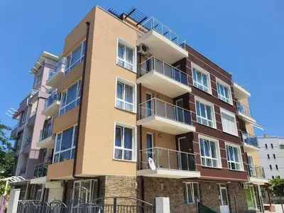 a tall building with balconies on the side of it at Neptun-Blue in Primorsko