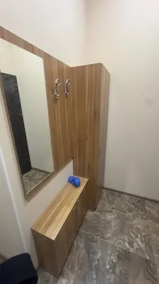 a bathroom with a wooden sink and a mirror at Studio paradise in Varna City
