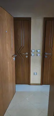 an empty room with two doors in a building at Rada's Apartment BSV in Burgas City