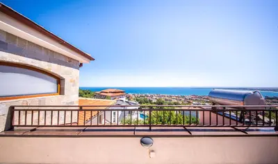 a balcony with a view of the ocean at Villa Belissima in Sveti Vlas