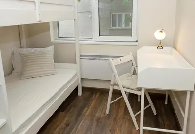 a small room with a bunk bed and a desk at Cozy & Functional by the Opera in Varna City
