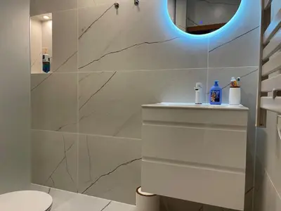 a bathroom with a sink and a mirror at Luxury Sea nest next Marina Dinevi in Sveti Vlas