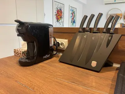 a row of knives sitting on top of a counter at Luxury Sea nest next Marina Dinevi in Sveti Vlas