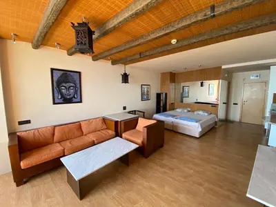 a living room with a couch and a bed at Sozopol Sunrise in Sozopol