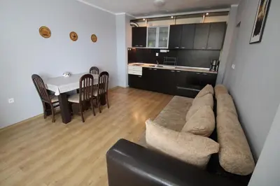 a living room and kitchen with a couch and a table at Amadeus 5 - Menada Apartments in Sunny Beach