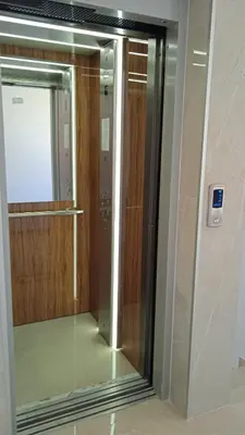 a glass door in a bathroom with a mirror at Sea Sunrise Apartment in Burgas City