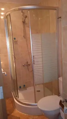 a bathroom with a shower and a toilet at Cosy Seaview apartment Budjaka in Sozopol