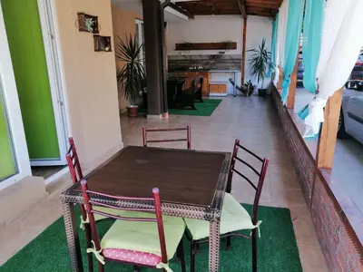 a table and chairs in a room with a hallway at Path ways to the Sea -Пътека към морето in Primorsko