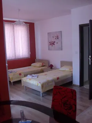 a room with three beds in a room at Guest House Nedelchevi in Primorsko