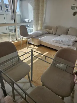 a living room with a couch and two chairs at Elite 4 in Sunny Beach