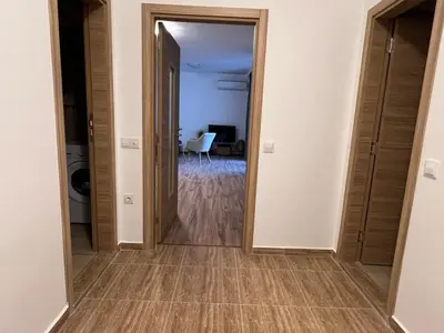 an empty hallway with a mirror and a room at Family Apartment with Sea View Vineyard Spa Resort Aheloy in Aheloy