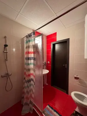 a bathroom with a shower with a toilet and a sink at Sea View Apartment Sveti Vlas 1 Bedroom K&R in Sveti Vlas