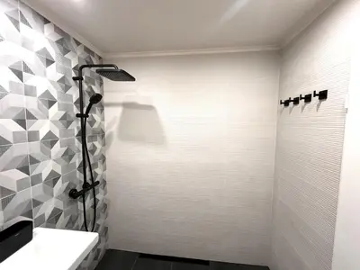 a bathroom with a shower and a sink at Miramar Front Beach Family Deluxe Studios No Swim Pool Access in Sunny Beach
