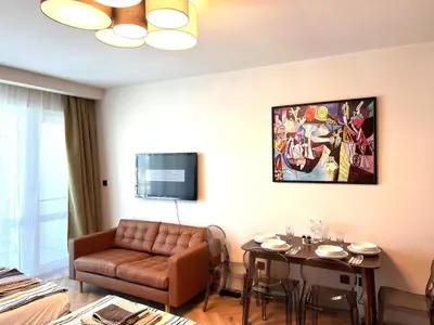 a living room with a couch and a table at Miramar Front Beach Family Deluxe Studios No Swim Pool Access in Sunny Beach