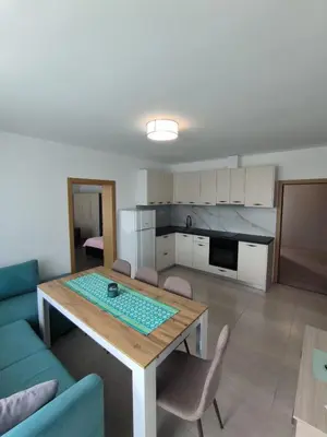 a living room with a table and a kitchen at complex Sol Marine sunny beach in Sunny Beach
