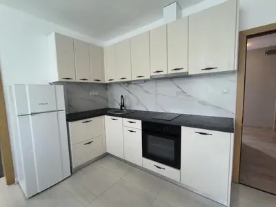 a white kitchen with white cabinets and a sink at complex Sol Marine sunny beach in Sunny Beach