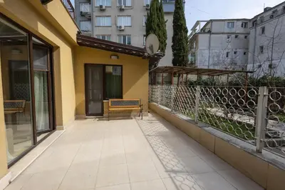 a balcony of a building with a bench on it at Sea Garden Marina 1 Apartment Varna in Varna City