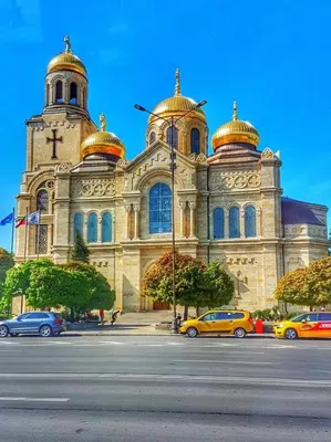 a cathedral with cars parked in front of it at Cozy Studio in Varna City