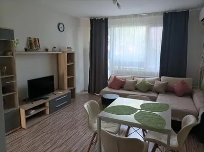 a living room with a couch and a table at Apartment Maria Luisa in Burgas City
