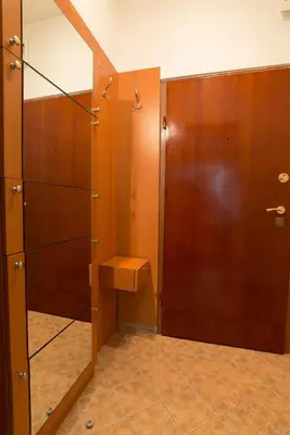 a bathroom with a toilet and a mirror at Sea Garden Plaza Apartment - Free Parking in Burgas City