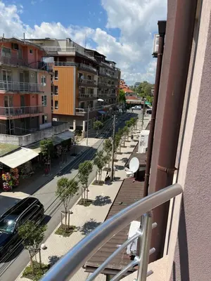 a view of a city street from a balcony at Сарафово холидейс in Burgas City