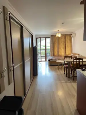 a living room with a table and a dining room at Amphora studio 209 in Sveti Vlas
