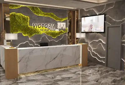 a lobby with a reception desk and a tv on a wall at Flores Garden Pool Side and Sea View Apartment in Chernomorets