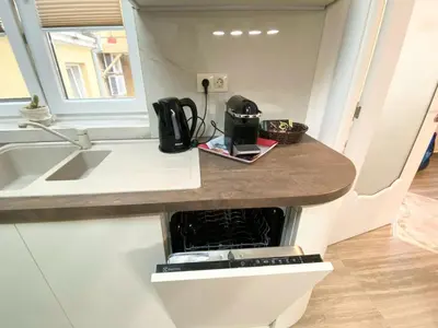 a kitchen with a counter with an oven in it at New Yorker 2 bedroom apartment in Varna City