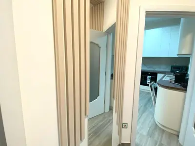 an open door to a kitchen with a counter top at New Yorker 2 bedroom apartment in Varna City