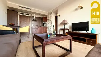 a living room with a couch and a table at ROYAL BEACH - Private Apartments - Center of Sunny Beach in Sunny Beach