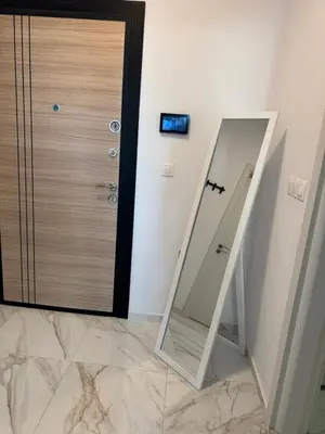 a mirror sitting next to a door in a bathroom at Central Park 7 in Burgas City